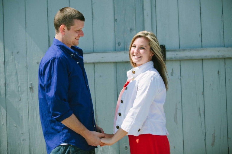 Man looking at his fiancee during engagement session in Rockport