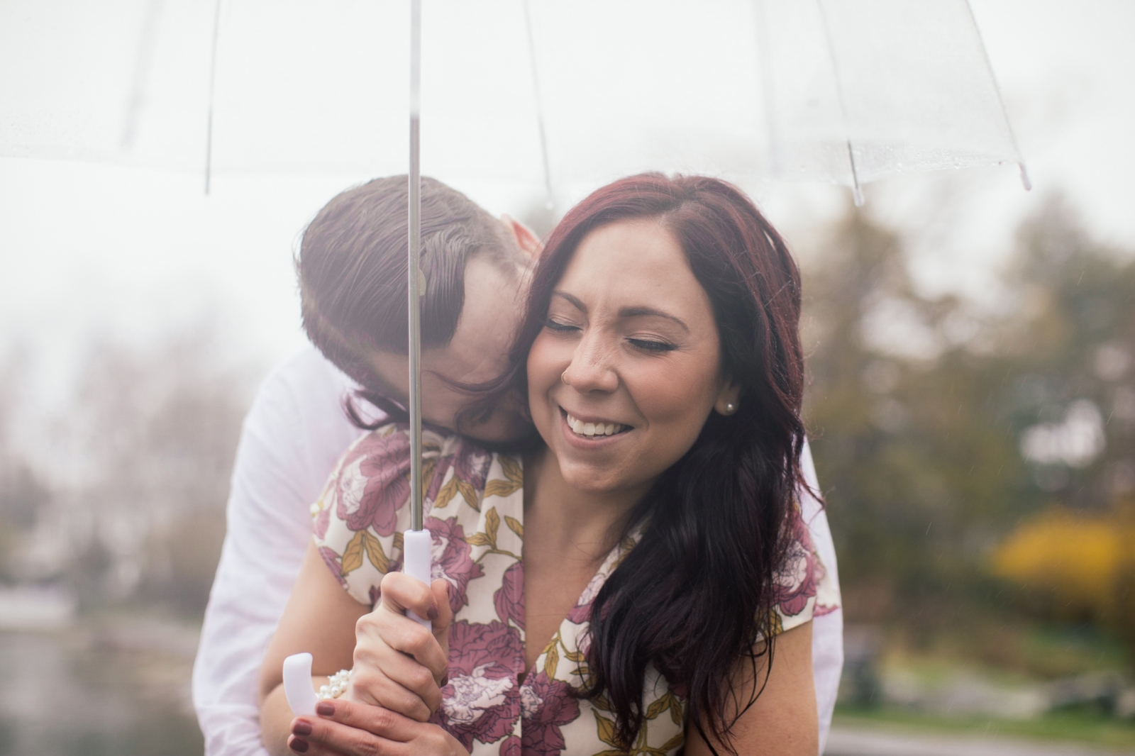 Engaged Couple Kissing Neck